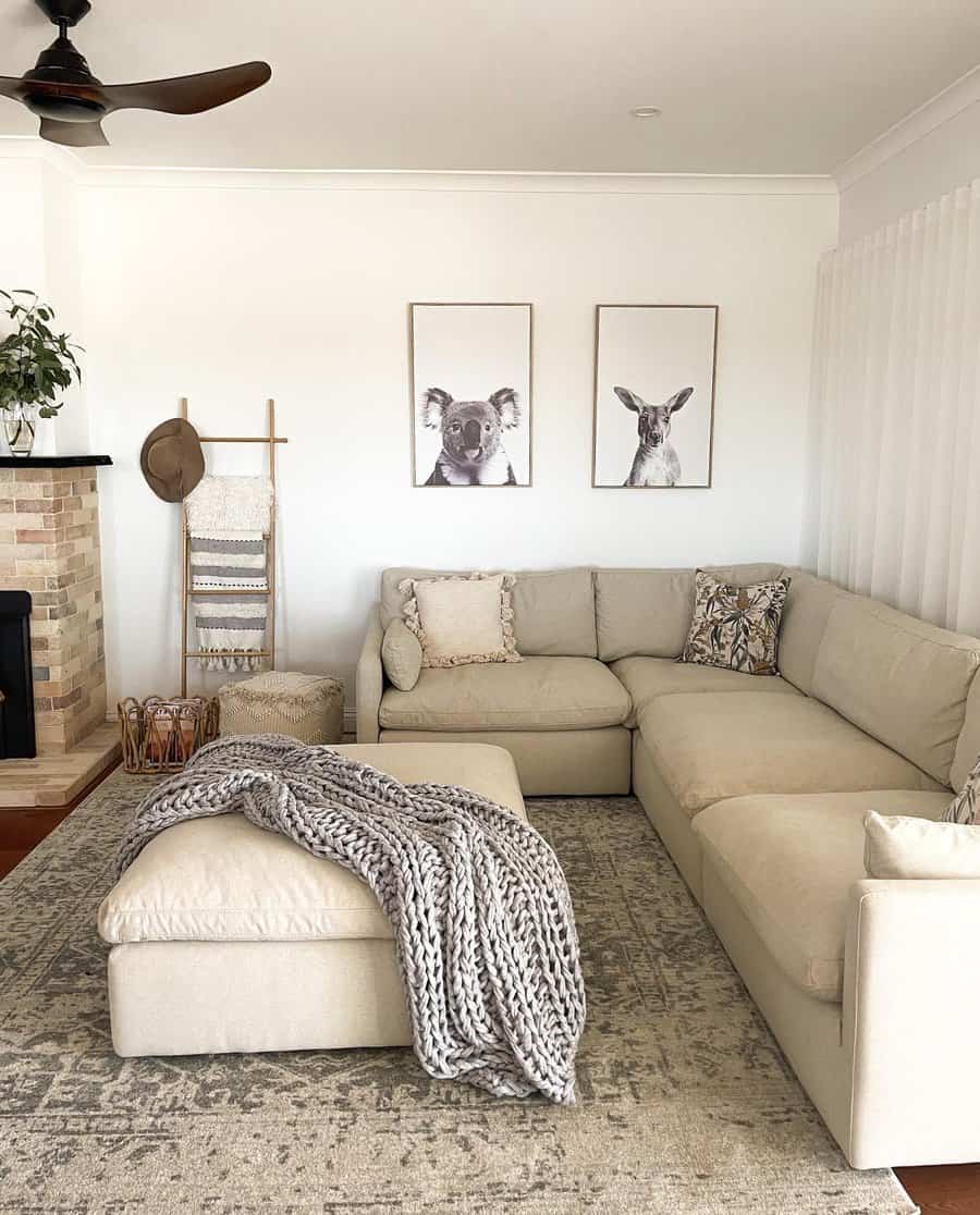 Neutral living room with animal art and sectional sofa