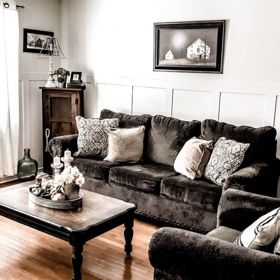 Warm living room with dark sofa and rustic decor