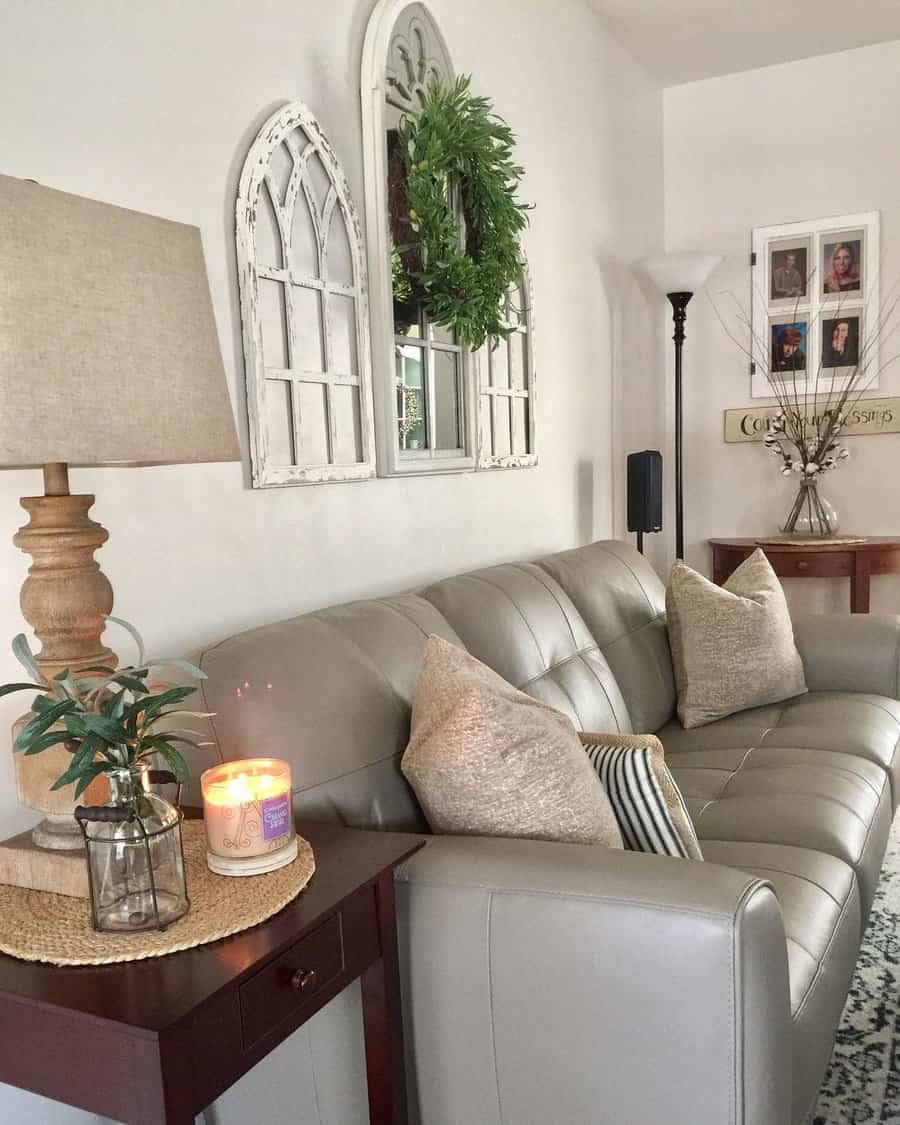 Inviting living room with arched mirrors and leather couch