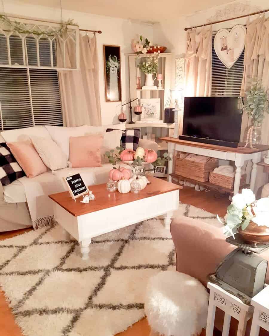 Charming living room with pink accents and fall decor