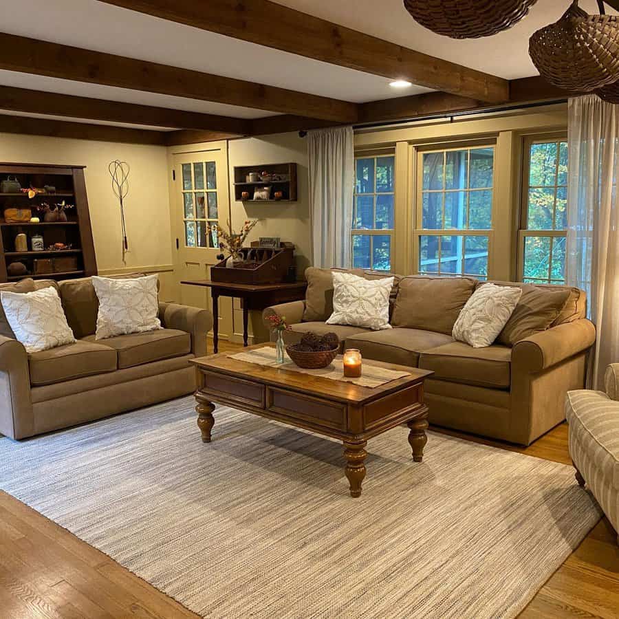 Traditional living room with beams and cozy couches