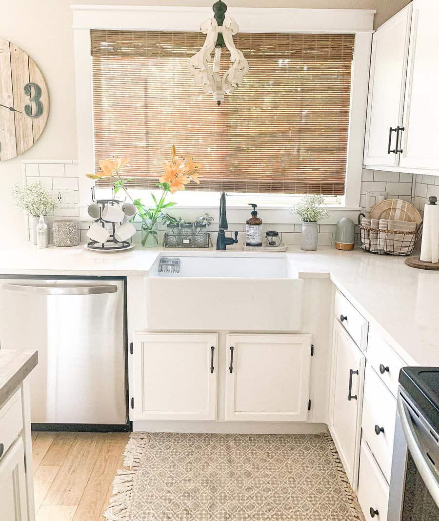 Sunlit kitchen with apron sink and bamboo shades