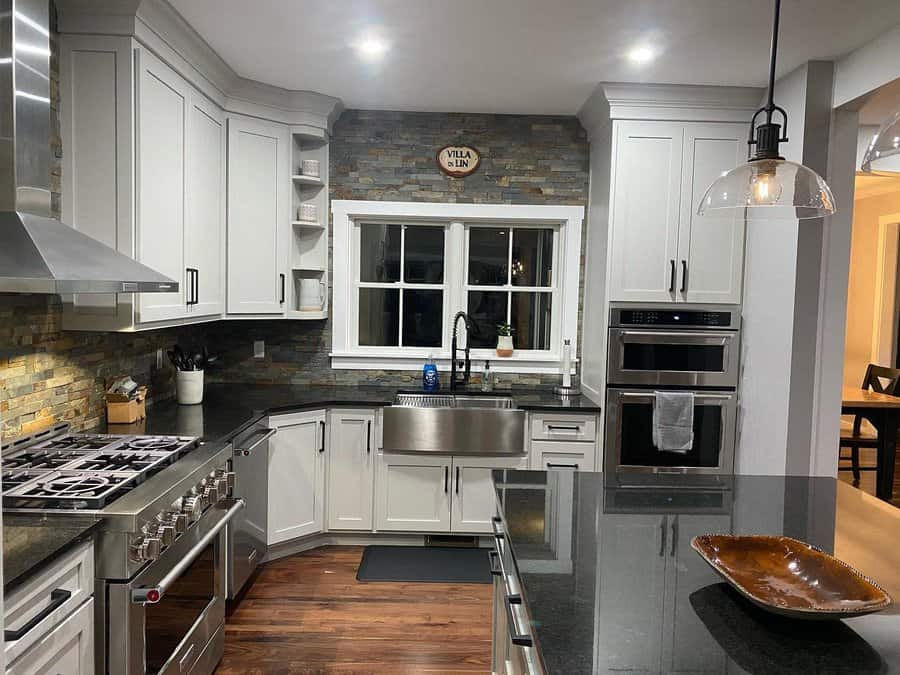 White cabinets with black countertops