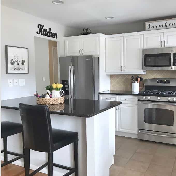 White cabinets with black countertops