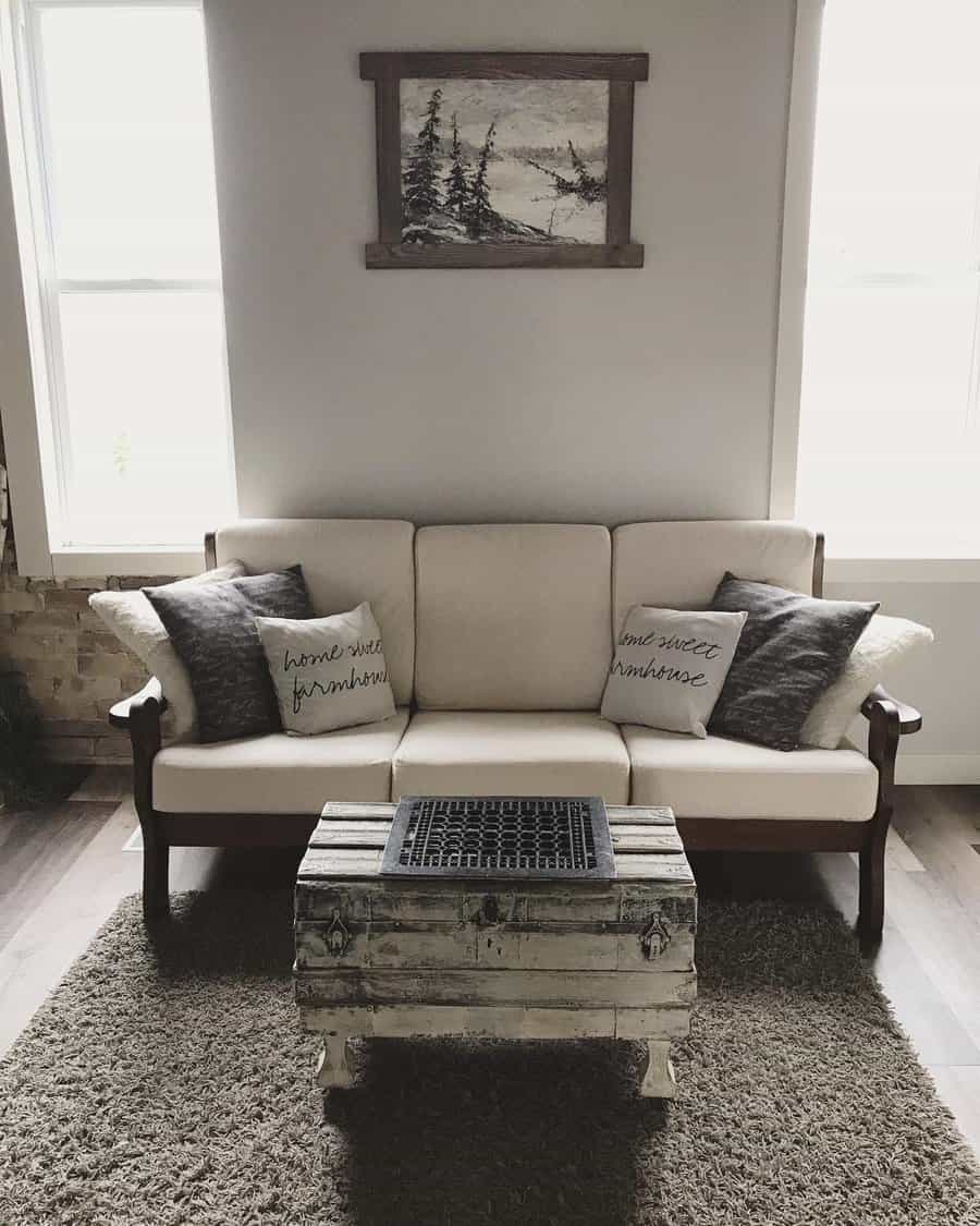 Minimalist living room with neutral tones and rustic trunk table