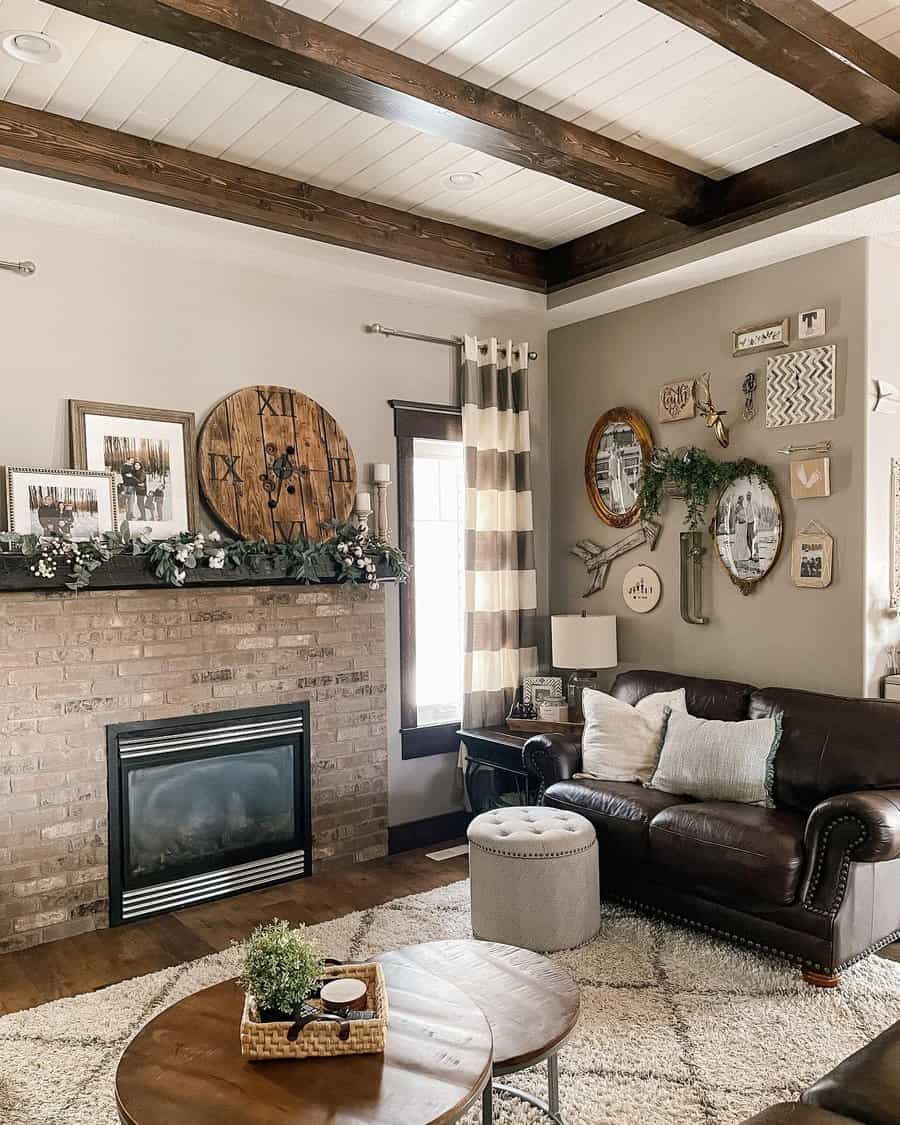 Stylish farmhouse living room with brick fireplace and beams