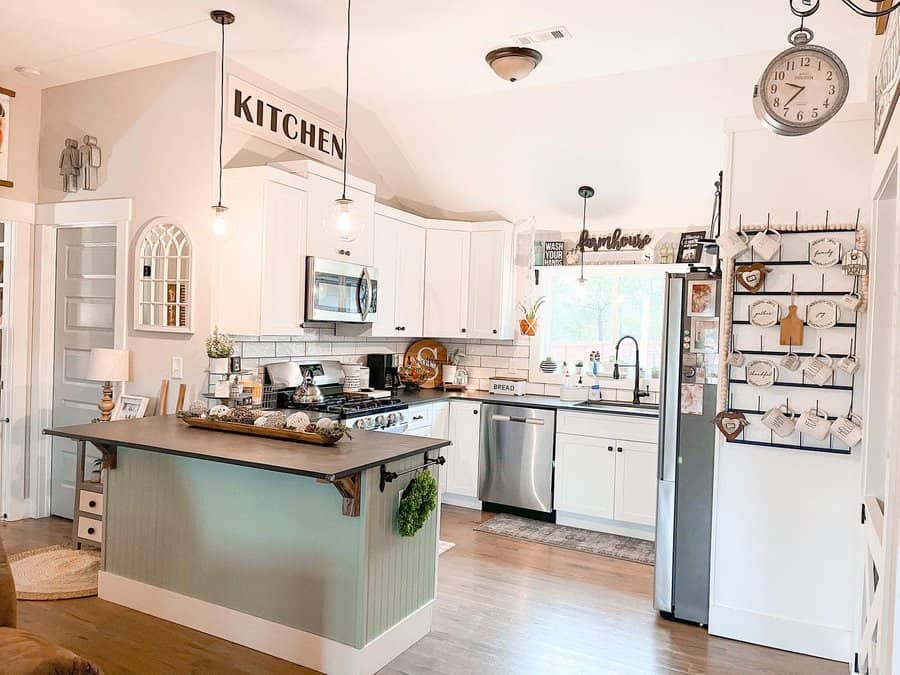 White kitchen with wooden flooring