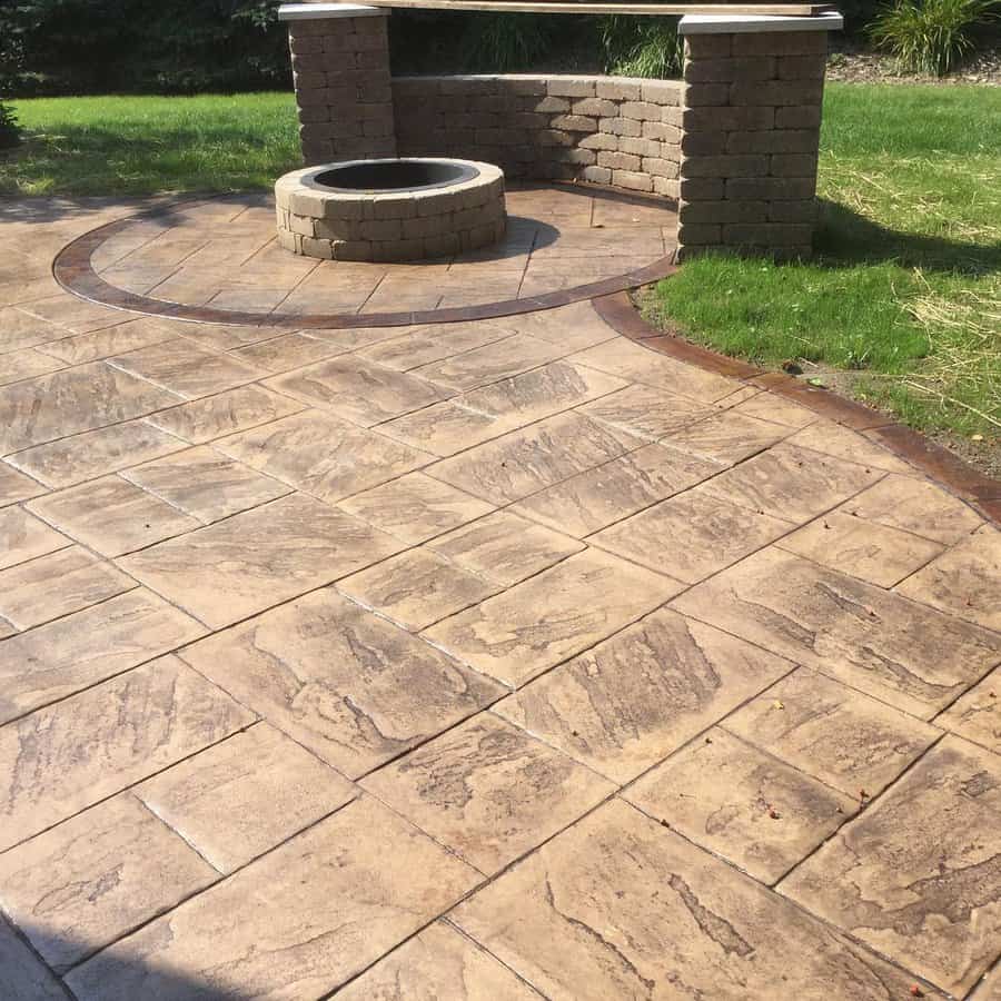 Stamped concrete patio with fire pit and curved bench