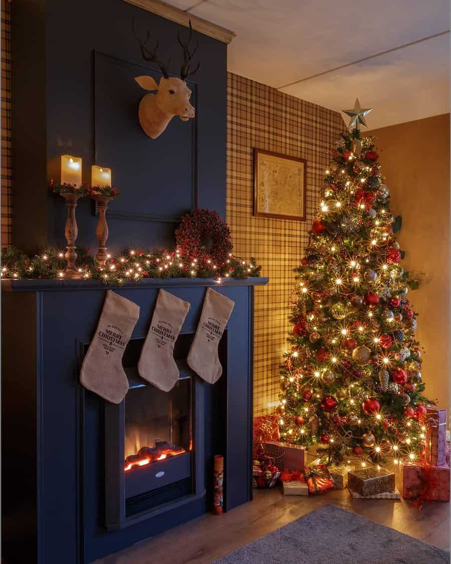 Cozy living room with Christmas tree and stockings hung by a decorated fireplace