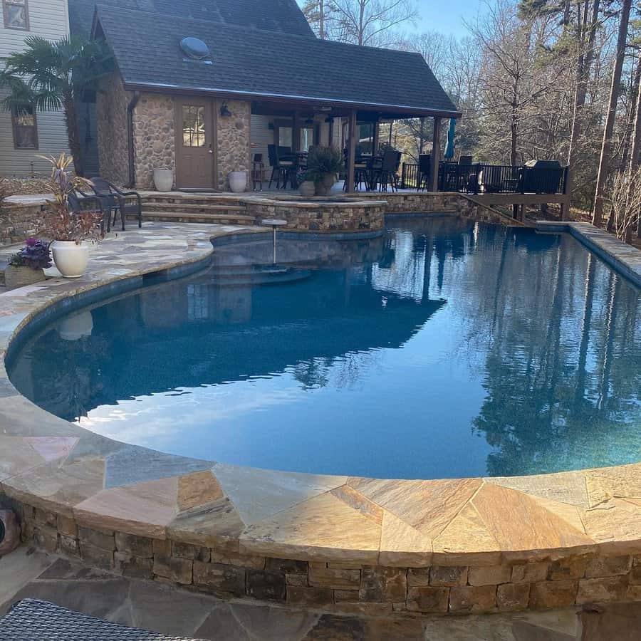 Stone Patio With Poolside Brick Fire Pit 