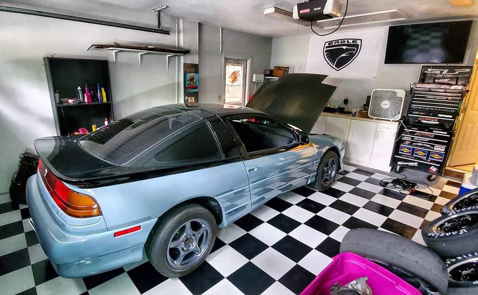 Garage man cave with checkerboard flooring