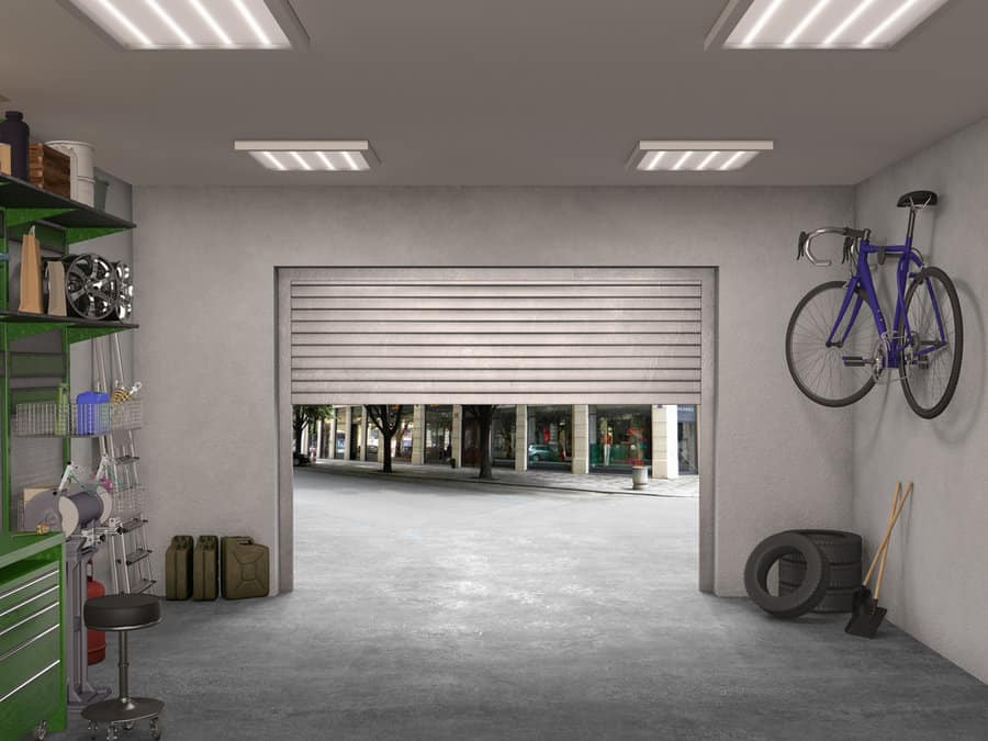 Garage interior with bright lights and open door