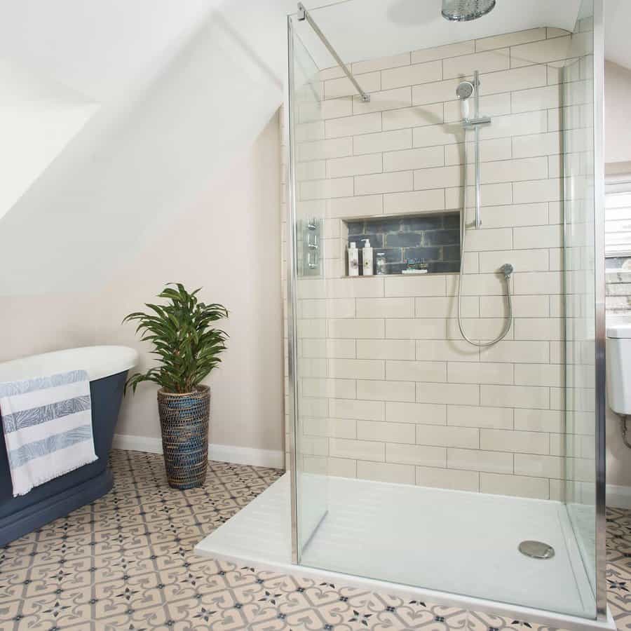 Bathroom shower with recessed wall shelf