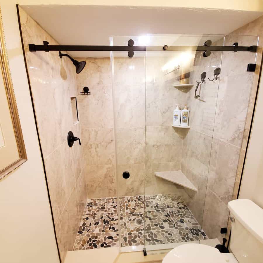 bathroom shower with a corner seat