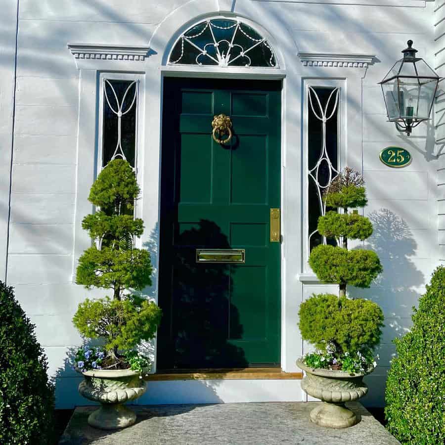 front garden with potted plants on the doorway