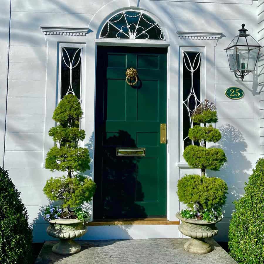 Front garden with potted plants on the doorway