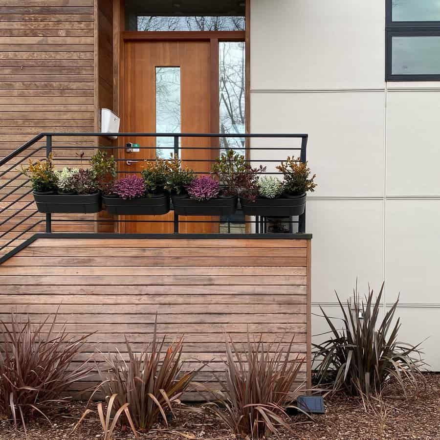 Front garden with mounted flower pots