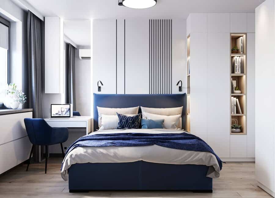 white bedroom with blue furnishings 