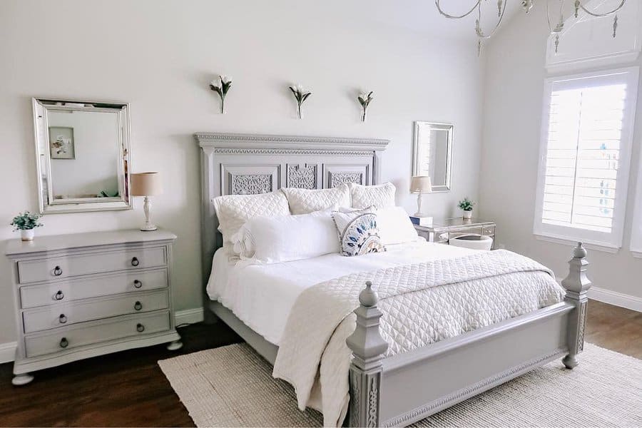 Elegant white bedroom with classic furniture