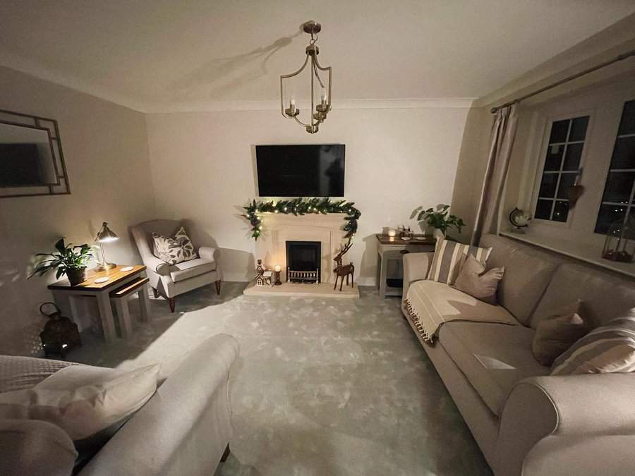 Elegant living room with festive garland and soft lighting