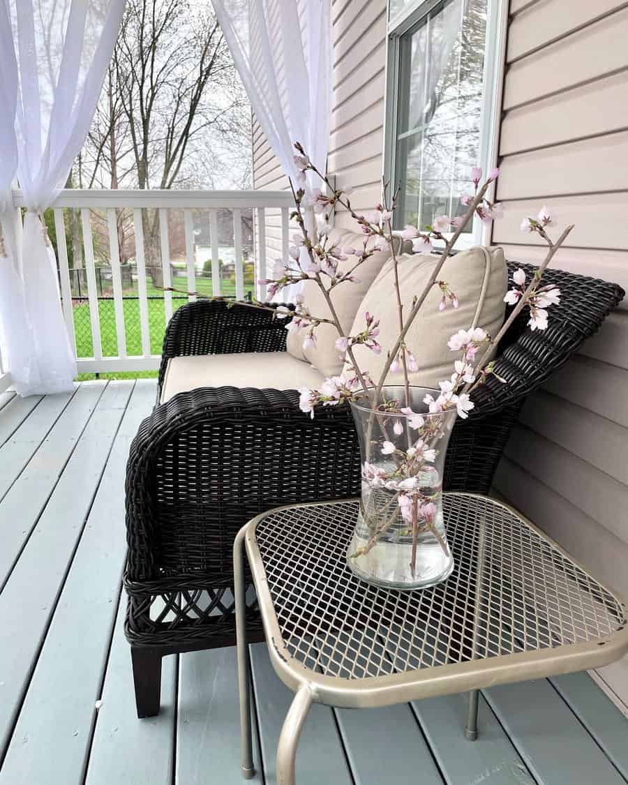 small porch with wicker furniture