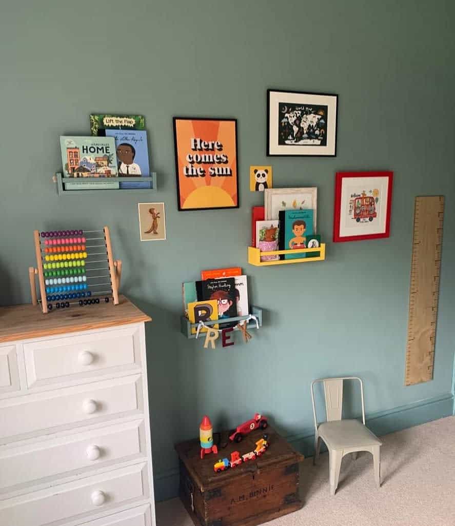 Kids art wall collage with floating shelves 