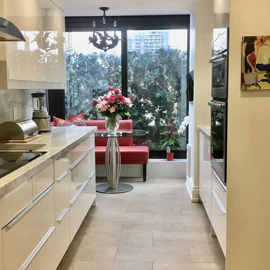 White kitchen with polished marble flooring