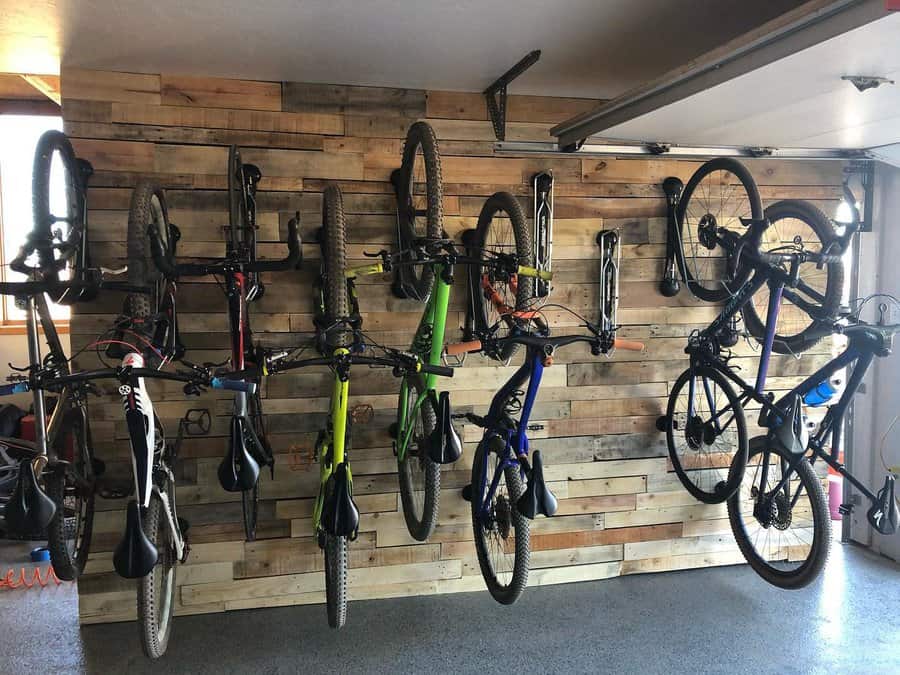 Garage with bikes mounted on a pallet wood wall