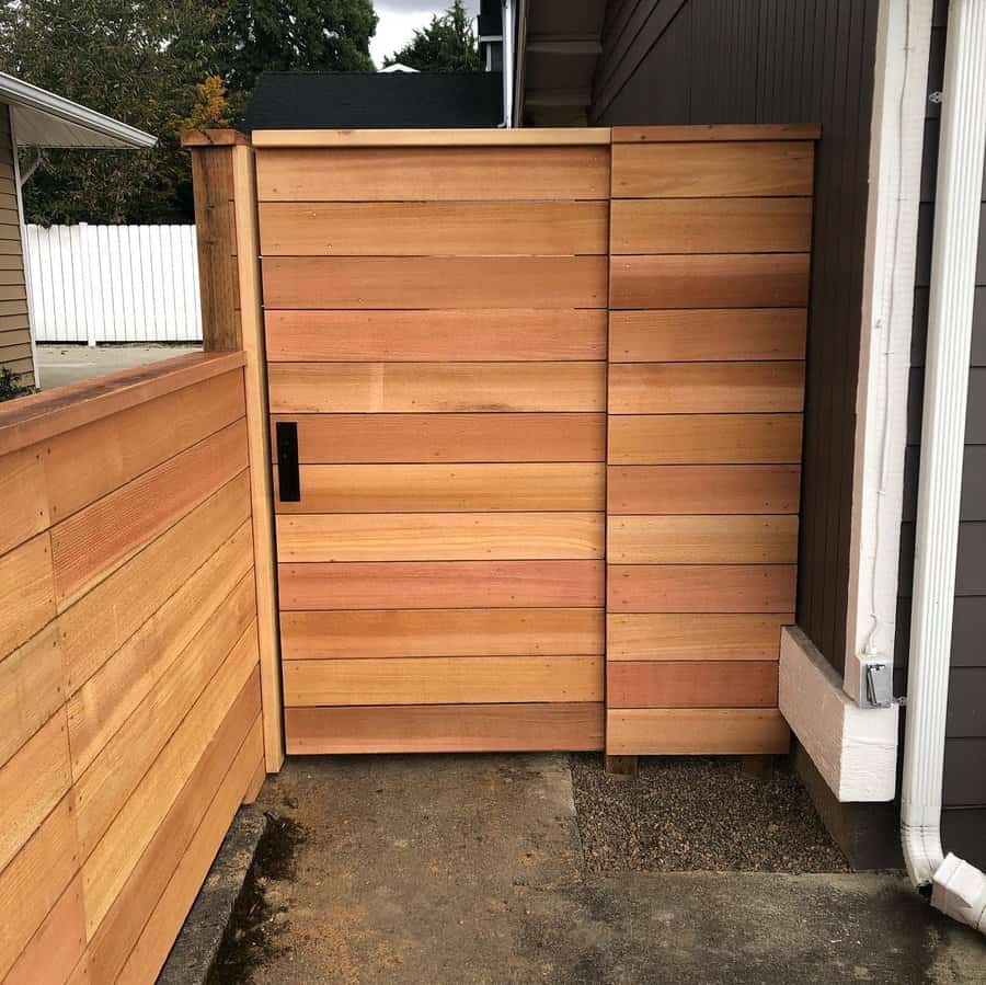 Gate and door on a wooden fence inviting and rustic ambiance