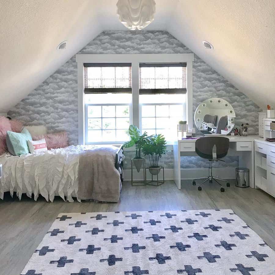 Chic attic bedroom with cloud-patterned wallpaper, a cozy daybed, and a stylish vanity. Soft textures and natural light create a dreamy retreat.