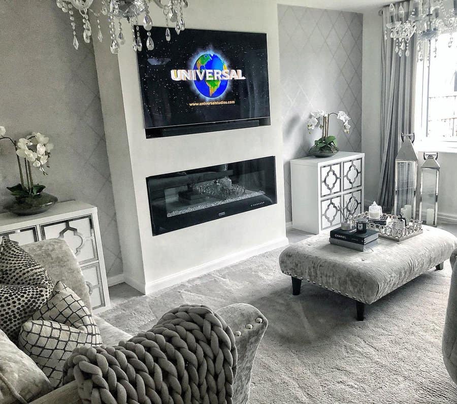 Luxurious living room with chandelier and fireplace