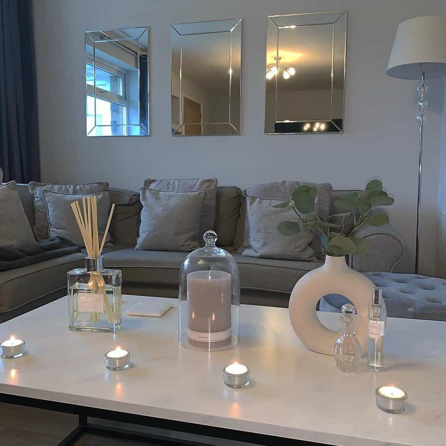 Chic living room with candles and mirrored wall decor