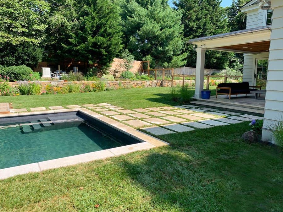 pavers and grass pool landscape