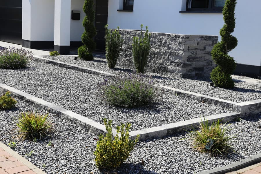 Modern gravel garden with tiered plant beds