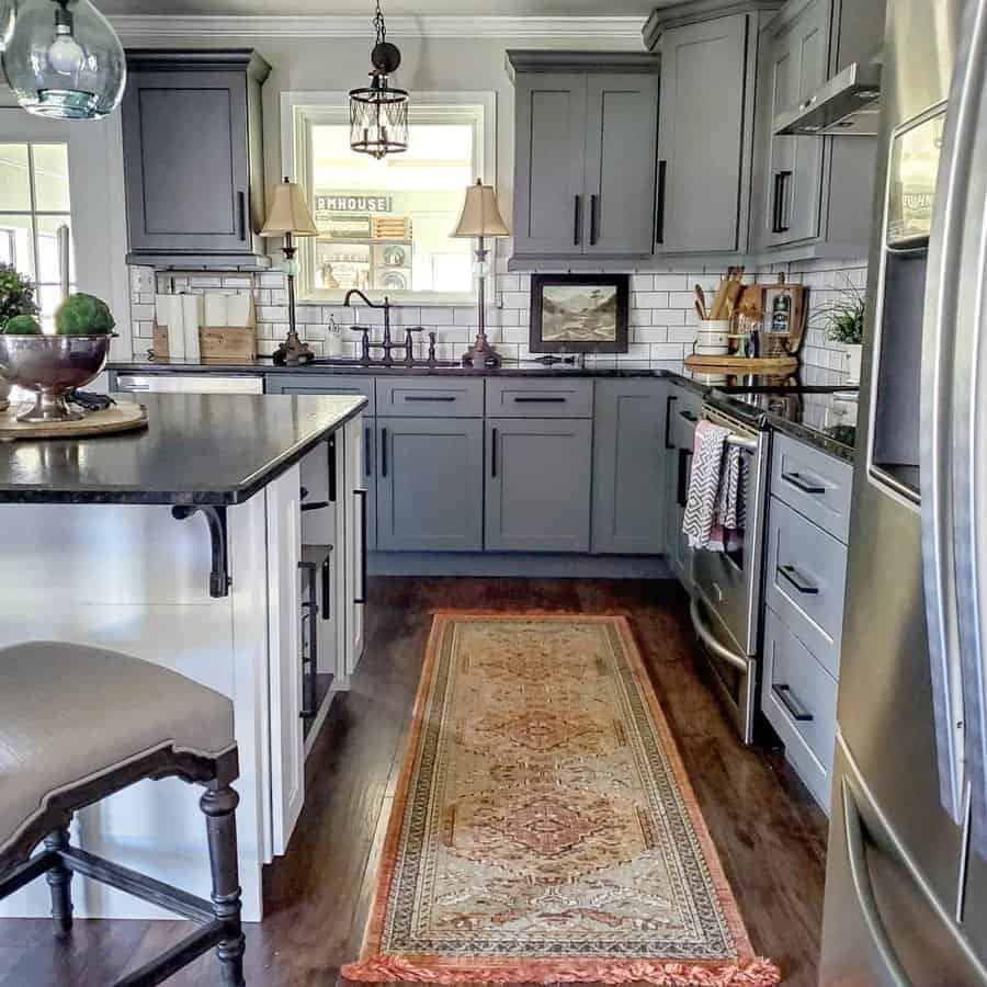 Farmhouse kitchen with gray cabinets and vintage rug