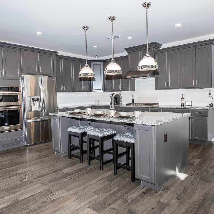 Chic kitchen with island and triple pendant lights