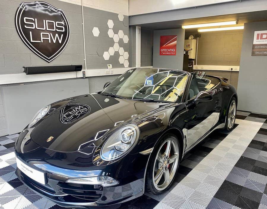 garage with grey wall and swisstrax tiles