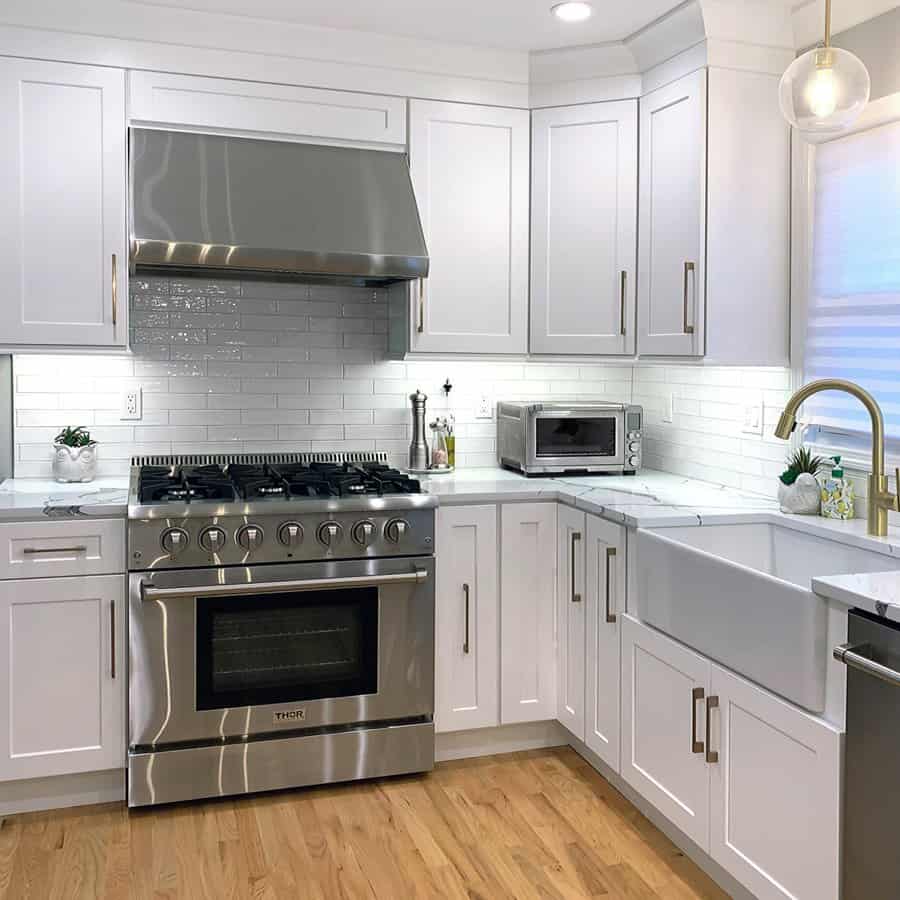 Corner white kitchen cabinet