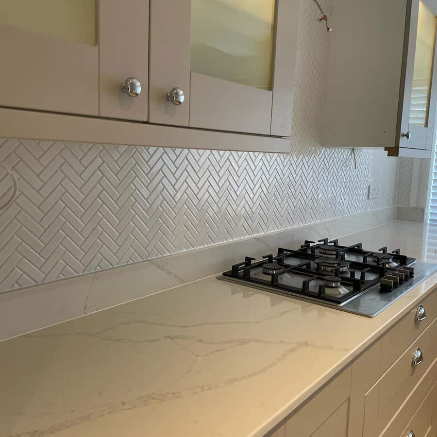 Herringbone tile kitchen backsplash