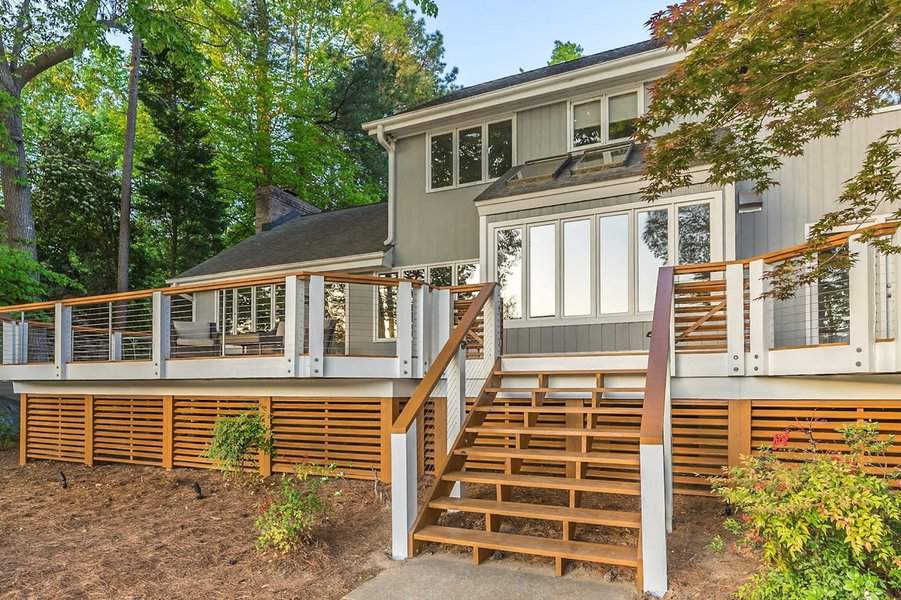 House with horizontal slat deck skirting and stairs