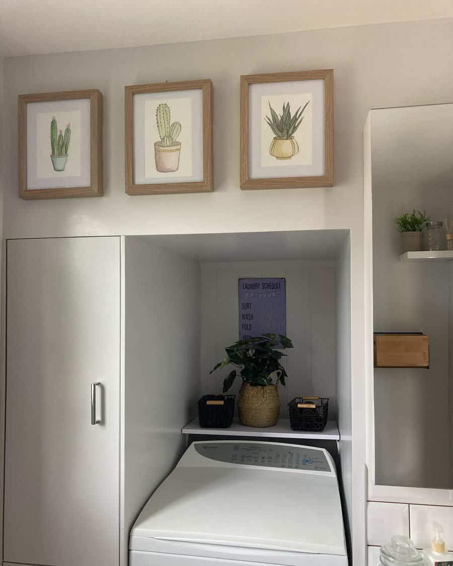 Laundry area with art and schedule on the wall