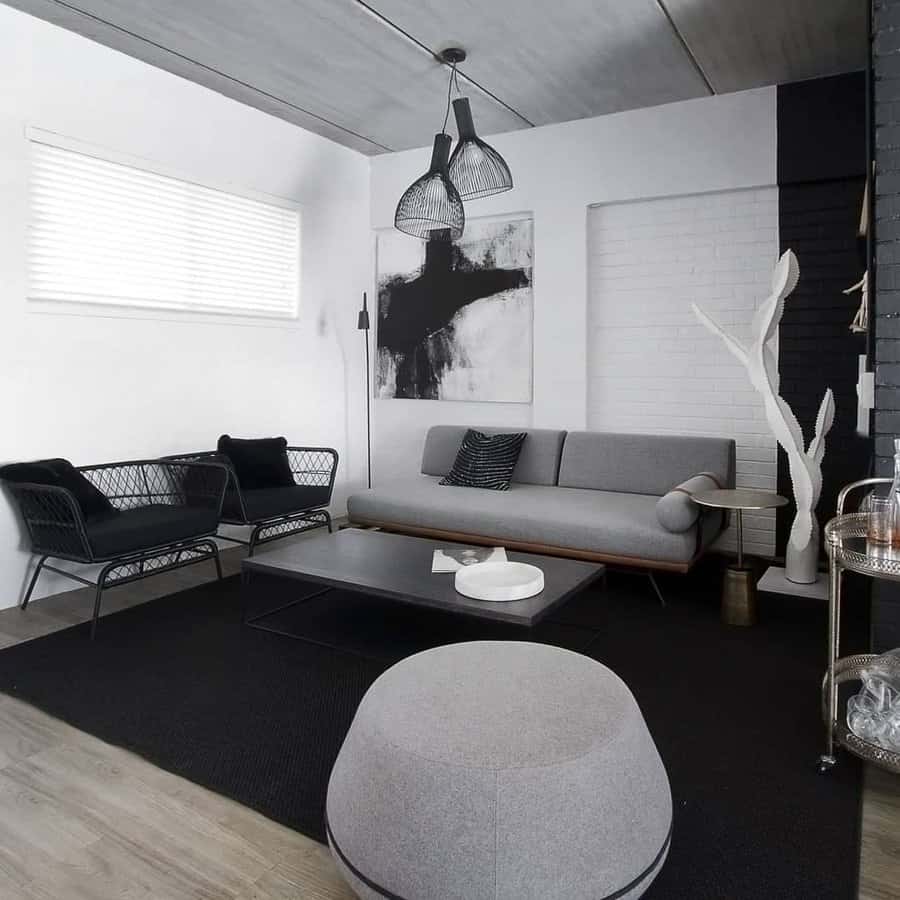 Monochrome industrial living room with unique lighting