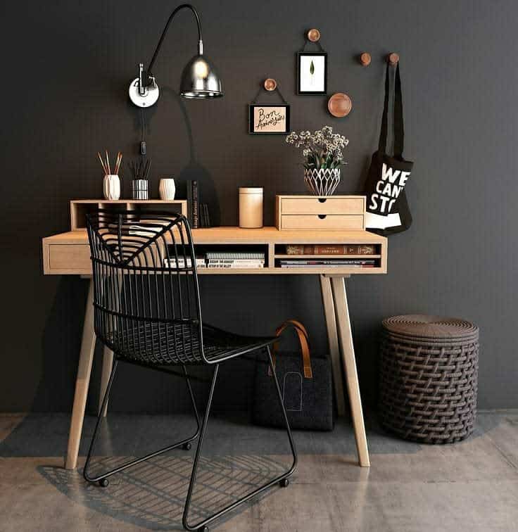 Scandinavian style office with black wall and wooden desk