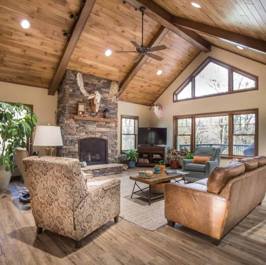 Rustic living room with stone fireplace and wooden beams