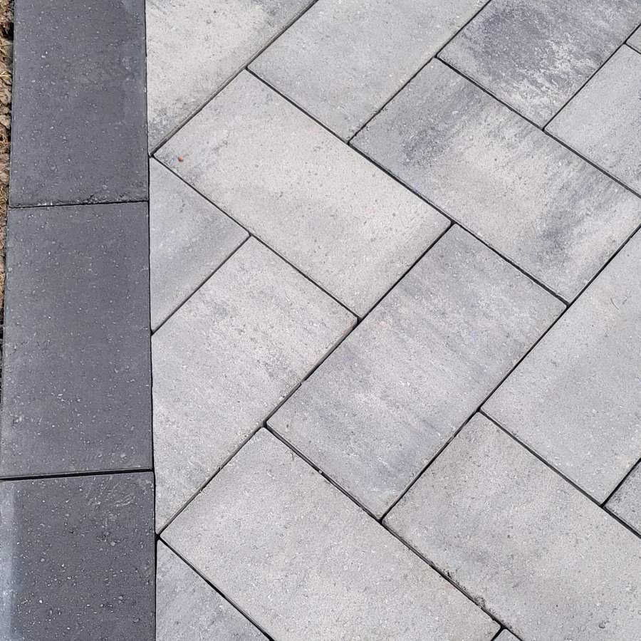 Close up of a gray patterned interlocking brick patio