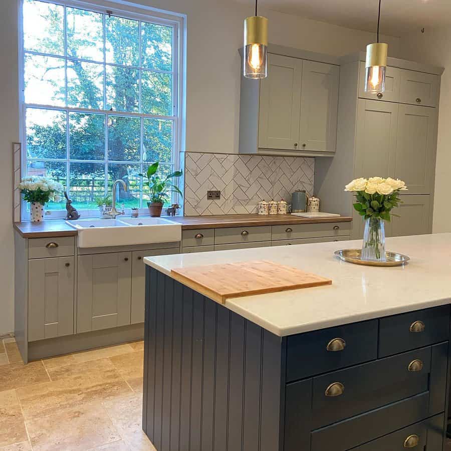 Charming kitchen with chevron tiles and garden view