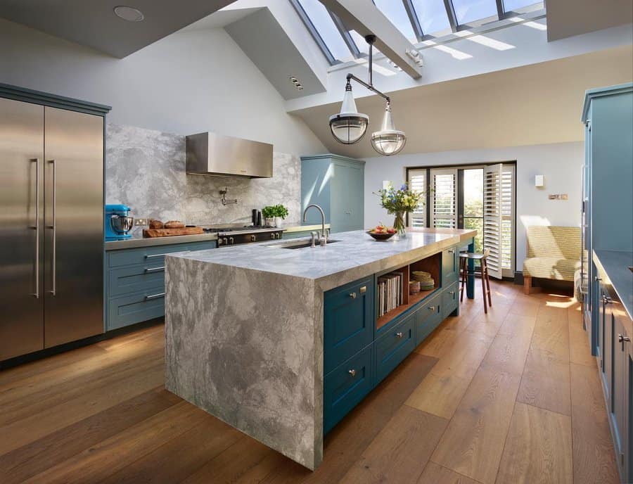 Bright kitchen with skylights and blue island