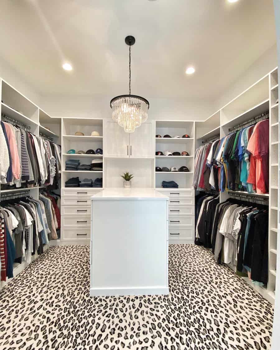 Walk in closet with island cabinet