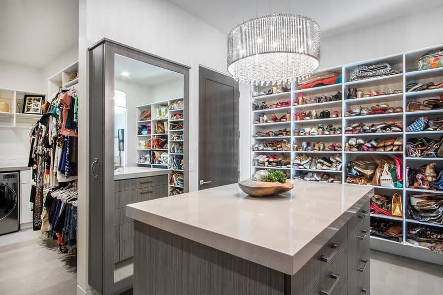 walk-in closet with island cabinet