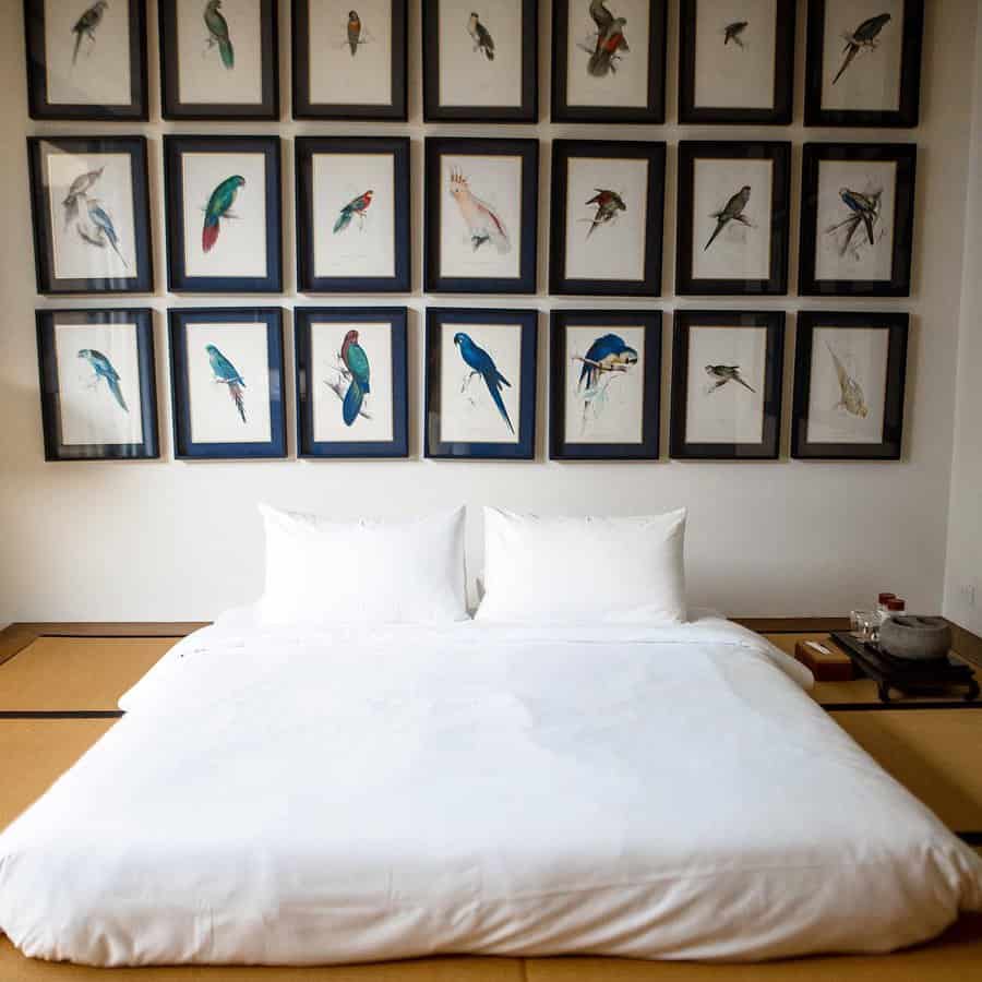 Bedroom with bird art gallery wall